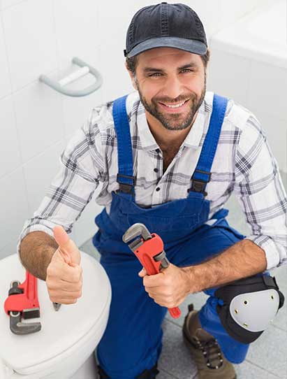 Plumber Smiling After Conducted Toilet Repairs